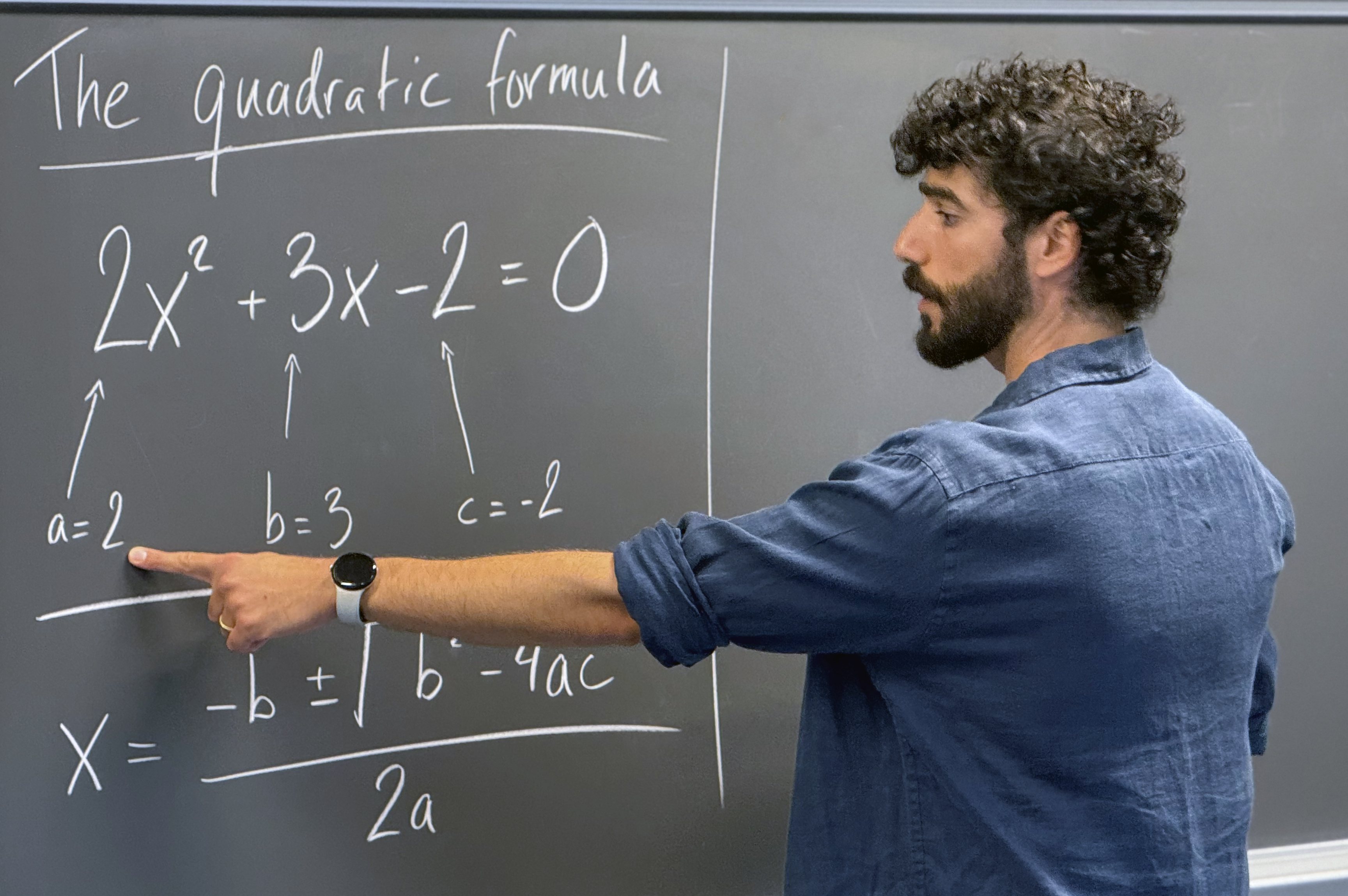 Jonatan Kara pointing out the coefficients a, b and c in a quadratic equation