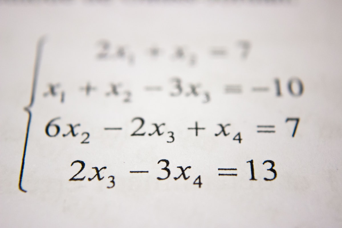 Mathematics equations and graphs on paper