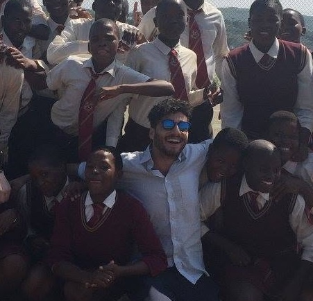 Jonatan with students in South Africa